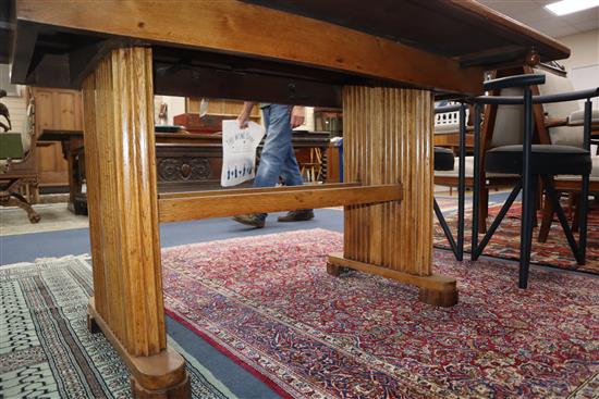 An Art Deco 1920s oak extending dining table L.137cm